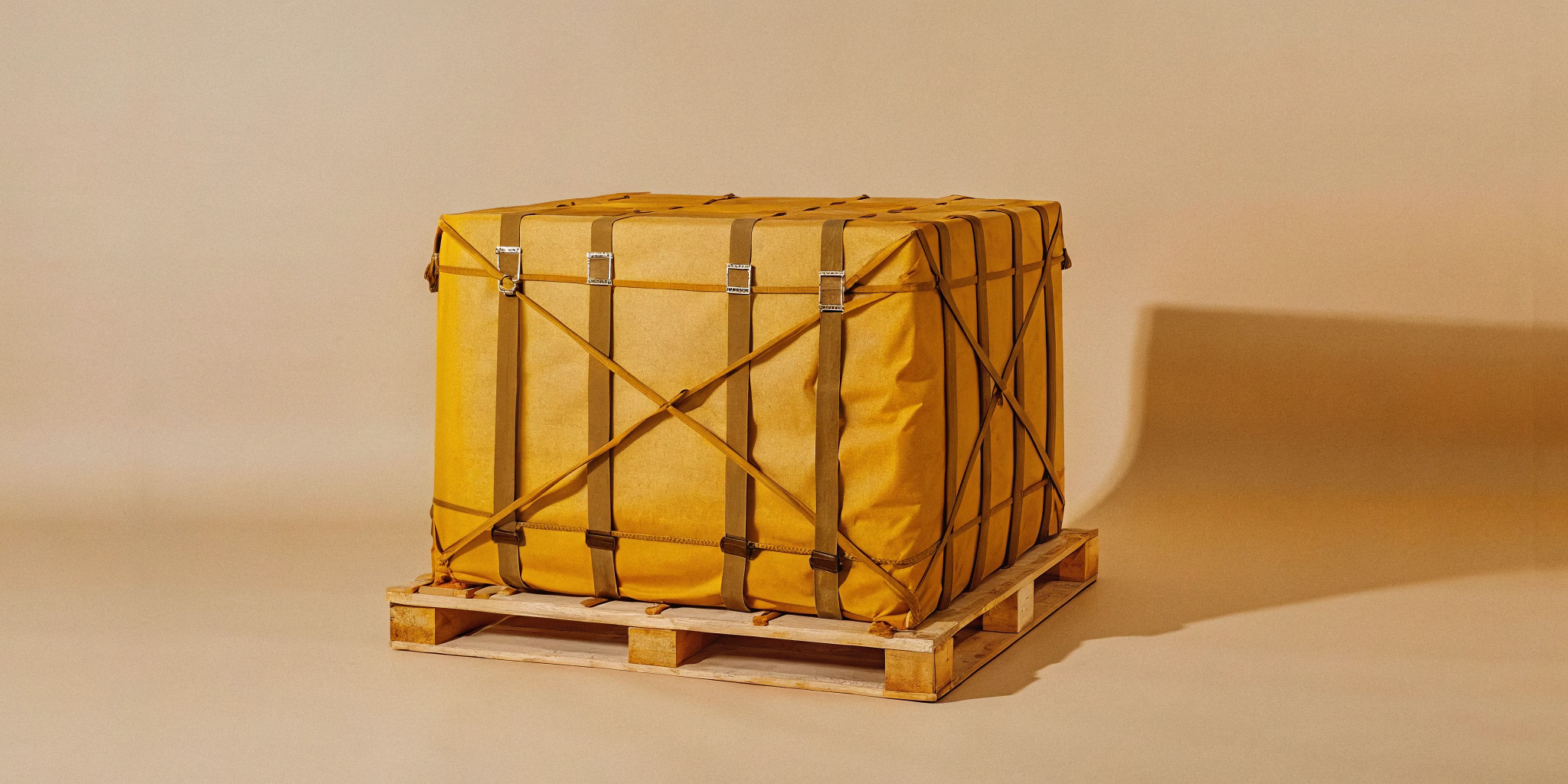 Ground handling equipment loading a cargo pallet into a widebody aircraft